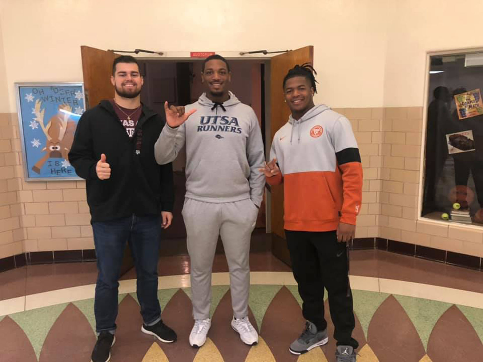College football players visit Carthage schools